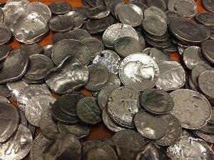 pile of mutilated coins