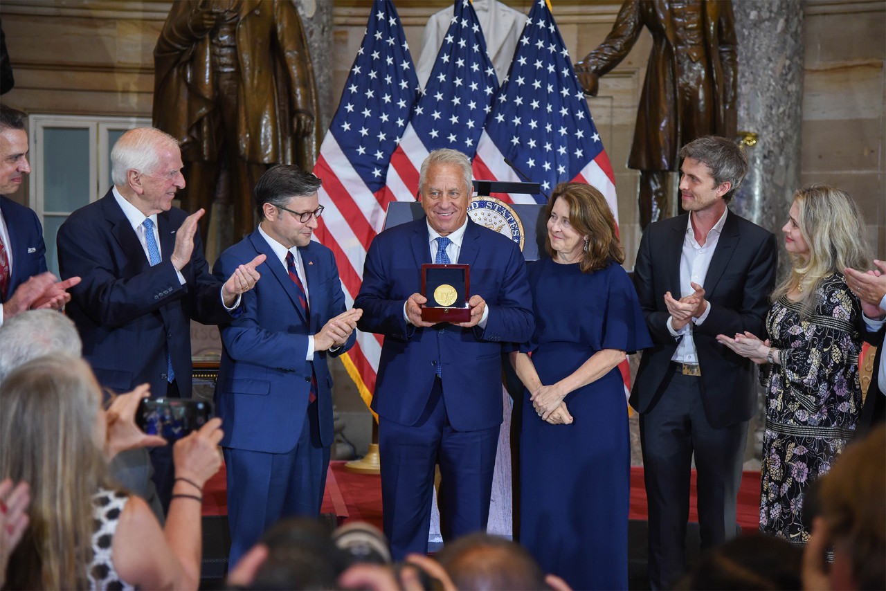 Greg LeMond Holding His Medal