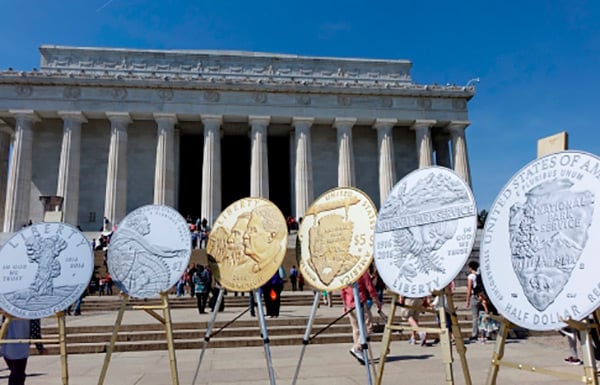 NPS coin designs displayed in front of the Lincoln Memorial.