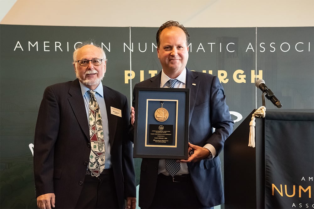 Director Paul Hollis accepts award