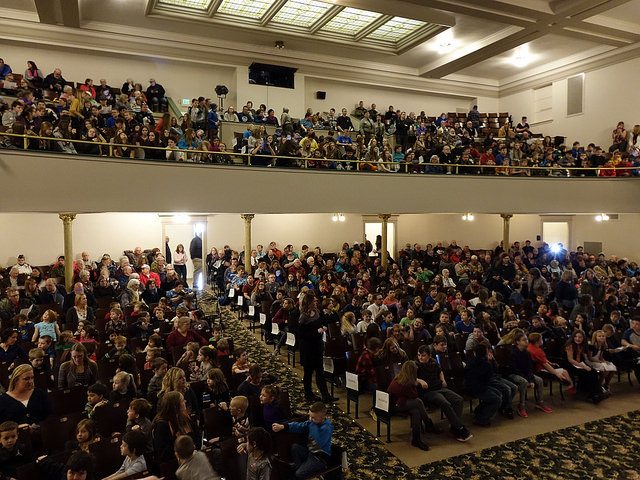 Crowd of people seated in a theater