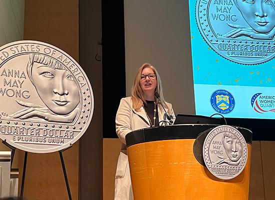 Michele Thompson standing at a podium