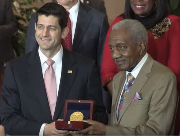 The Reverend F.D. Reese accepts the Congressional Gold Medal from Speaker Paul Ryan.
