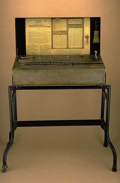 Millionaire Calculating Machine in its case.