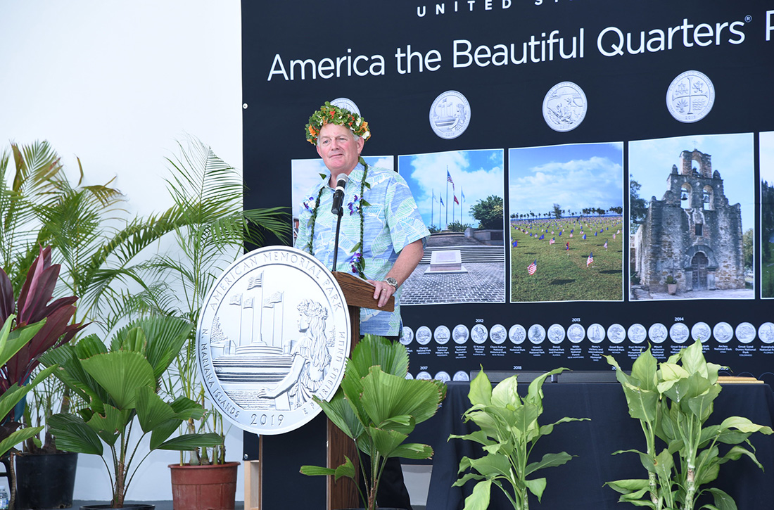 Director Ryder standing at a podium
