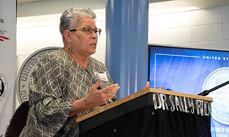 Ventris Gibson speaking at the podium