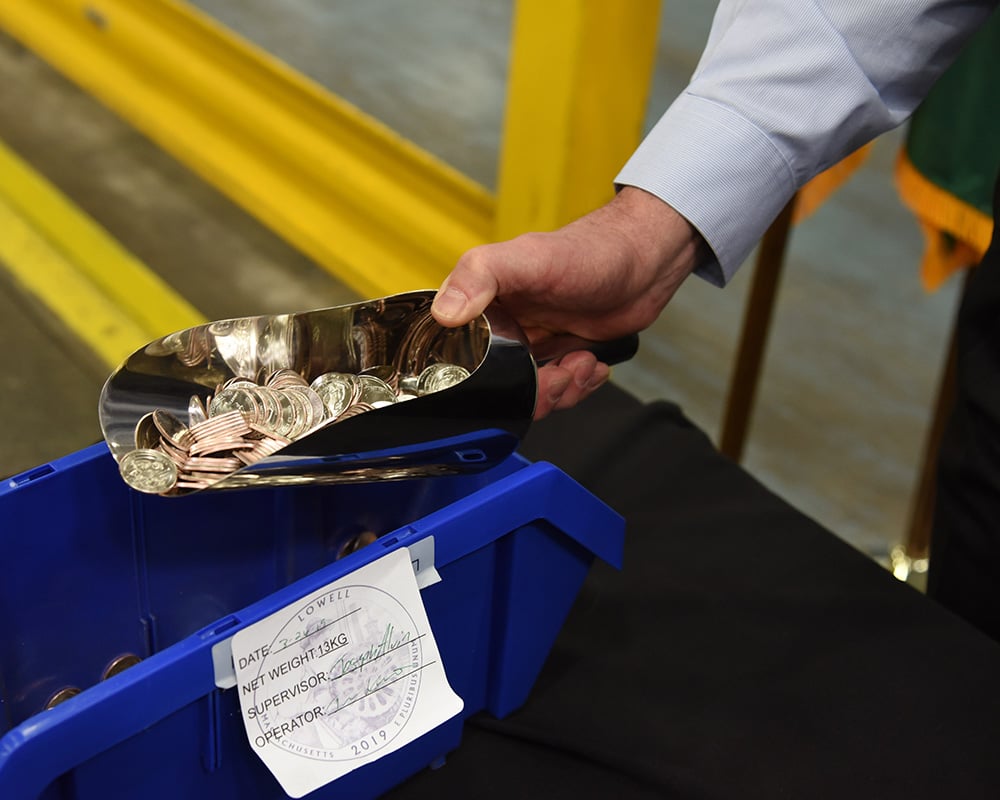 Scoop filled with 2019 Lowell National Historical Park quarters