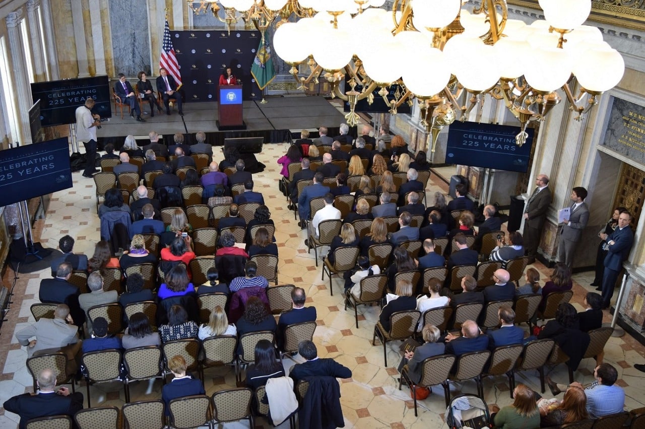 crowd of people seated in chairs