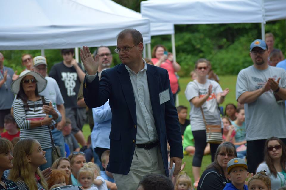 Ron Sanders standing in a crowd