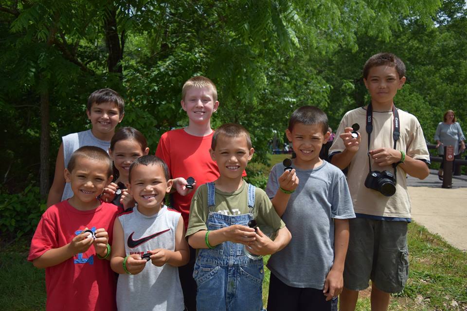 Kids holding quarters