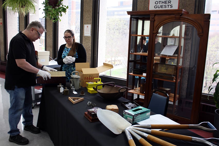 Philadelphia Mint employee looks at a historic ledger book