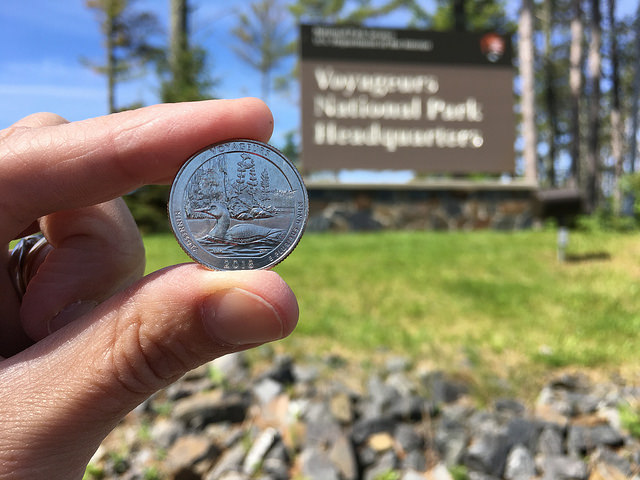 Voyageurs National Park Quarter with national park sign in the background