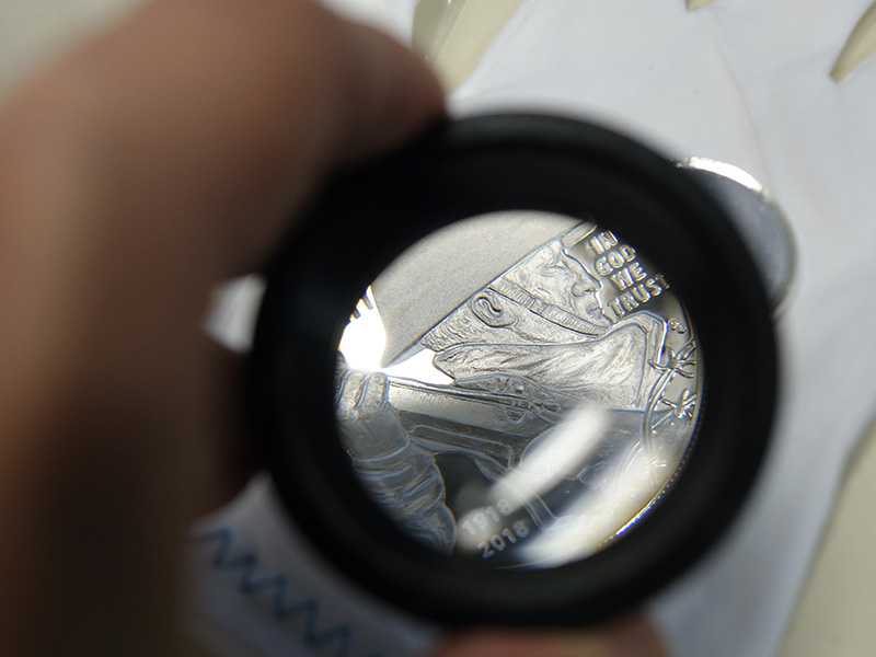 coin under a magnifying lens