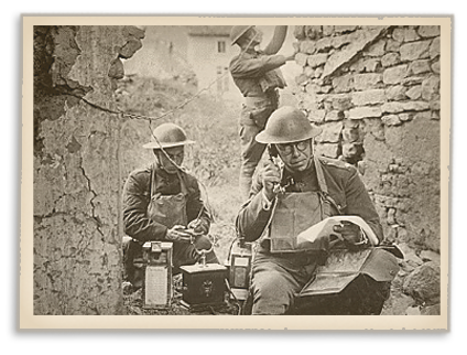 Three soldiers operating communications equipment.