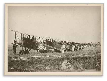 148th American Aero Squadron field. Making preparations for a daylight raid on German trenches and cities. The machines are lined up and the pilots and mechanics test their planes. Petite Sythe, France.