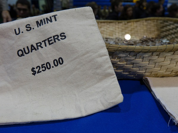 Shawnee National Forest quarters fill a basket following the ceremonial coin pour.
