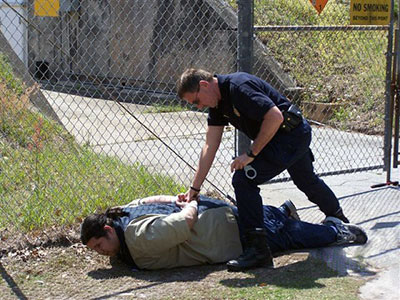 Mint Police officer James Downey handcuffs a role–playing “suspect” during a Comprehensive Terrorism Lab exercise at the Federal Law Enforcement Training Center in Glynco, Georgia. 