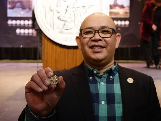 Artistic Infusion Program artist Paul C. Balan is recognized for his design of the Pictured Rocks National Lakeshore quarter.