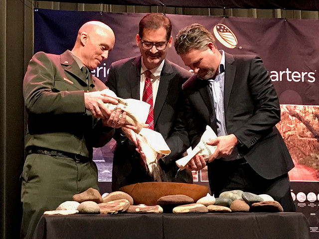 Representatives from the U.S. Mint, National Park Service, and Department of Interior participate in the ceremonial coin pour.