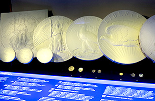 display of coins sculpted in plaster